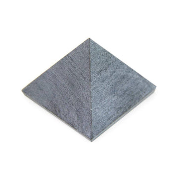 Soapstone pyramid, angled close-up showing raw matte finish and detailed texture.